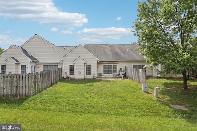back of property with a patio