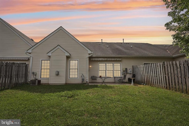 back of property with a patio