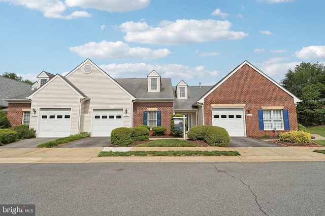 view of front facade featuring brick siding and driveway