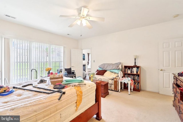 bedroom with light carpet, ceiling fan, and access to exterior
