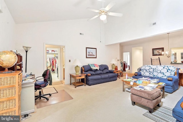 carpeted living area featuring high vaulted ceiling, an office area, and a ceiling fan