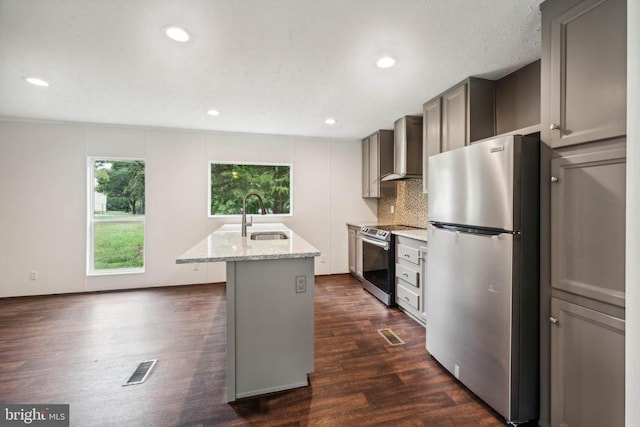 8708 Berkeley Farms Ln, Partlow, VA 22534 - kitchen featuring a sink, wall chimney exhaust hood, dark wood-style floors, light stone countertops, and appliances with stainless steel finishes