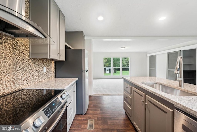 8708 Berkeley Farms Ln, Partlow, VA 22534 - kitchen featuring gray cabinets, wall chimney exhaust hood, stainless steel appliances, and a sink