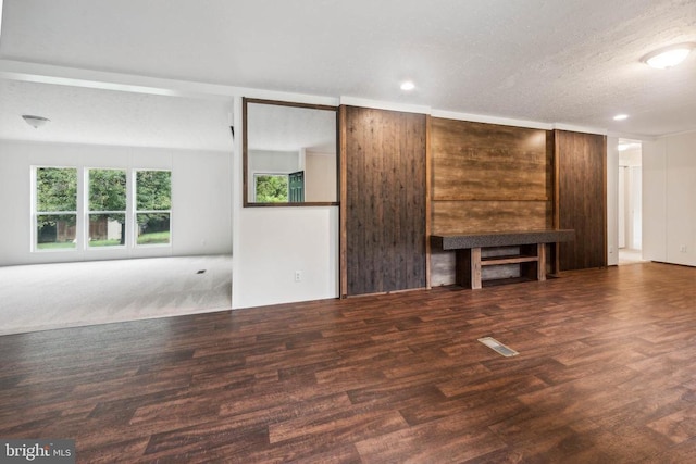 8708 Berkeley Farms Ln, Partlow, VA 22534 - unfurnished living room featuring visible vents, wood finished floors, and recessed lighting