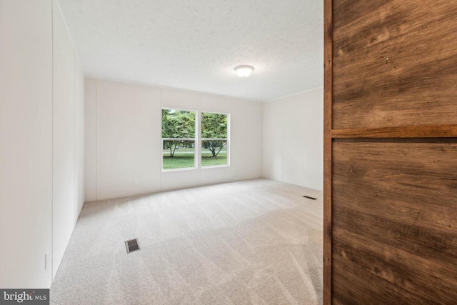 8708 Berkeley Farms Ln, Partlow, VA 22534 - carpeted spare room featuring a textured ceiling and visible vents