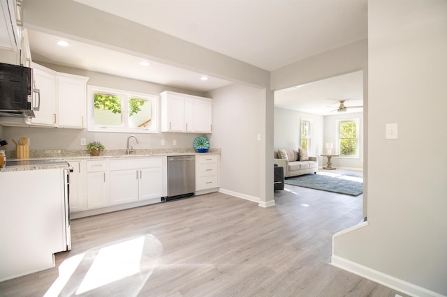 kitchen featuring dishwasher, black microwave, white cabinetry, baseboards, and light wood finished floors