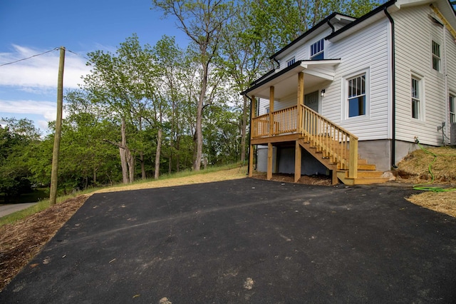 view of side of property with stairs