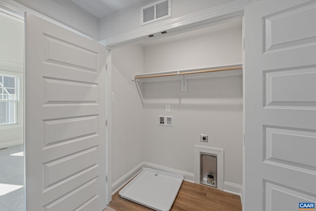 washroom with wood finished floors, laundry area, visible vents, electric dryer hookup, and washer hookup
