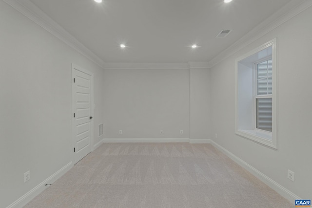 empty room with ornamental molding, visible vents, recessed lighting, and light colored carpet