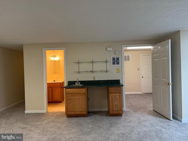 11068 Alum Springs Rd, Culpeper, VA 22701 - kitchen featuring light carpet, dark countertops, brown cabinetry, and open shelves
