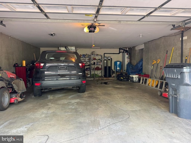 11068 Alum Springs Rd, Culpeper, VA 22701 - garage with a garage door opener and water heater
