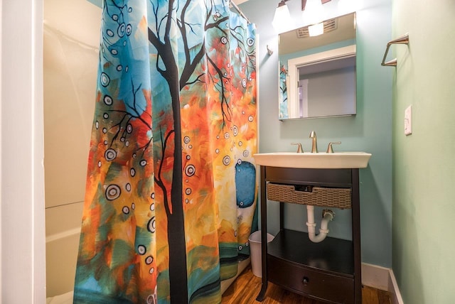 2860 Uphill Dr, Broadway, VA 22815 - full bath with a sink and wood finished floors