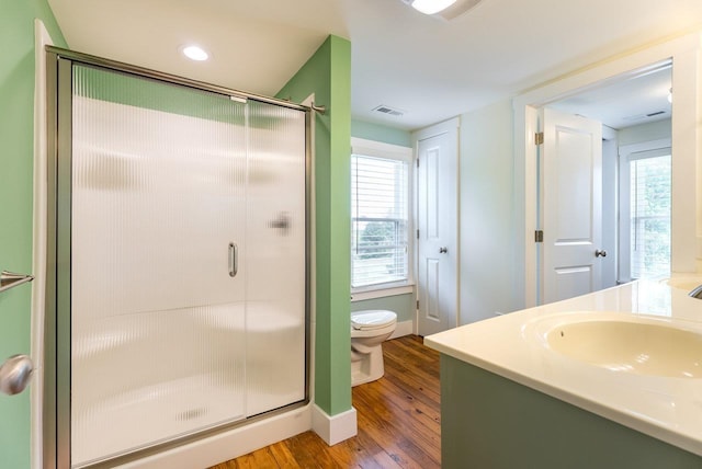 2860 Uphill Dr, Broadway, VA 22815 - bathroom featuring wood finished floors, a stall shower, toilet, and healthy amount of natural light