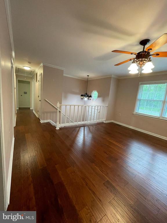 4504 Mine Rd, Fredericksburg, VA 22408 - spare room with attic access, crown molding, dark wood finished floors, baseboards, and ceiling fan