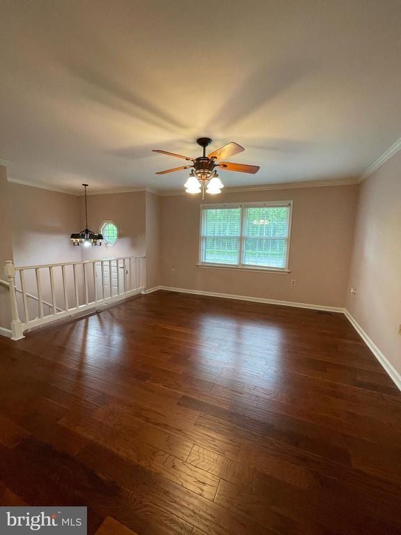 4504 Mine Rd, Fredericksburg, VA 22408 - empty room with crown molding, a ceiling fan, baseboards, dark wood-style floors, and a chandelier