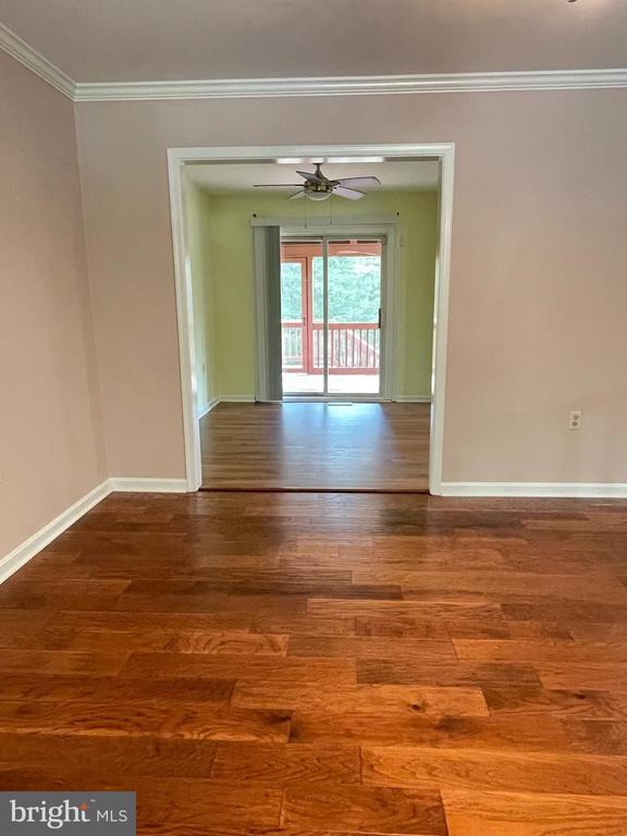 4504 Mine Rd, Fredericksburg, VA 22408 - empty room with wood finished floors, ornamental molding, baseboards, and ceiling fan