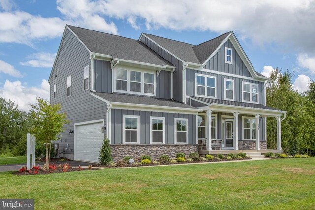 18 Whitehall Blvd, Spotsylvania, VA 22551 - craftsman-style house with board and batten siding, an attached garage, a front lawn, a porch, and stone siding
