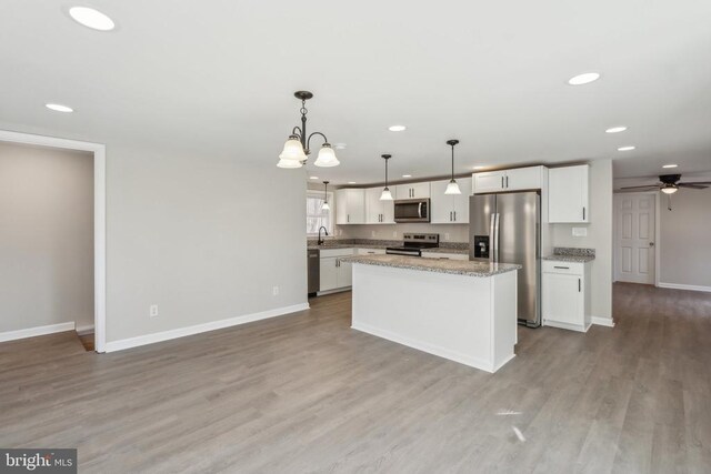 2215 Hoover Rd W, Haywood, VA 22722 - kitchen with appliances with stainless steel finishes, recessed lighting, ceiling fan, white cabinetry, and baseboards
