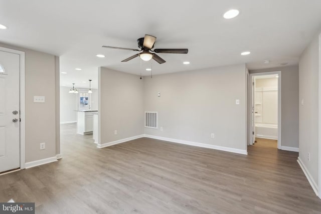 2215 Hoover Rd W, Haywood, VA 22722 - unfurnished living room featuring a ceiling fan, wood finished floors, recessed lighting, and baseboards