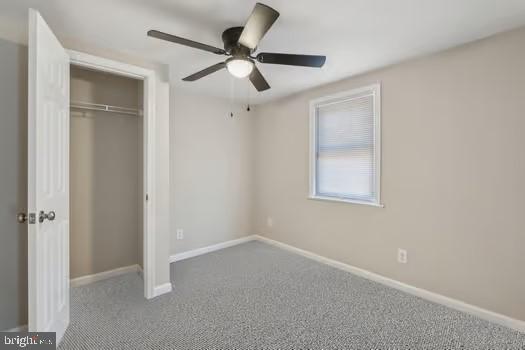 2215 Hoover Rd W, Haywood, VA 22722 - unfurnished bedroom with a closet, carpet flooring, baseboards, and a ceiling fan