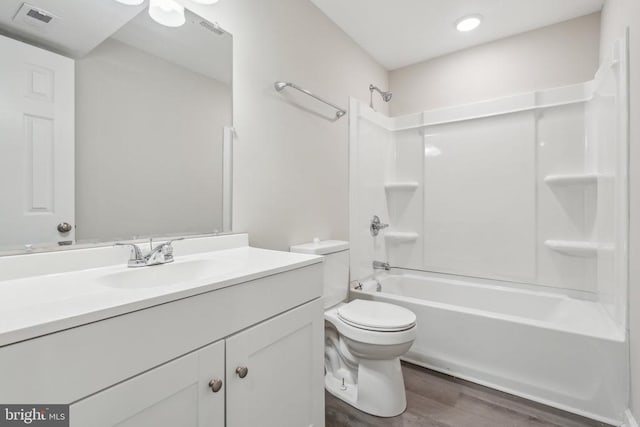 2215 Hoover Rd W, Haywood, VA 22722 - full bathroom with wood finished floors, toilet, vanity, and bathtub / shower combination