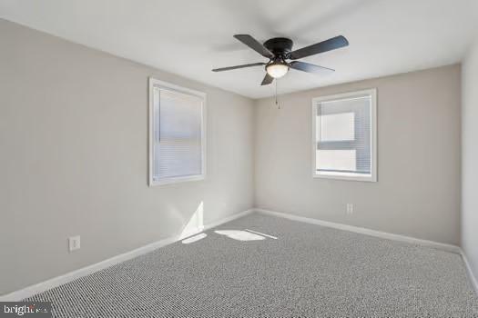 2215 Hoover Rd W, Haywood, VA 22722 - spare room with baseboards, a ceiling fan, and carpet flooring