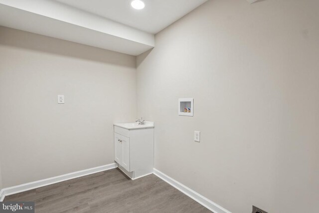 2215 Hoover Rd W, Haywood, VA 22722 - washroom with washer hookup, wood finished floors, baseboards, hookup for an electric dryer, and a sink