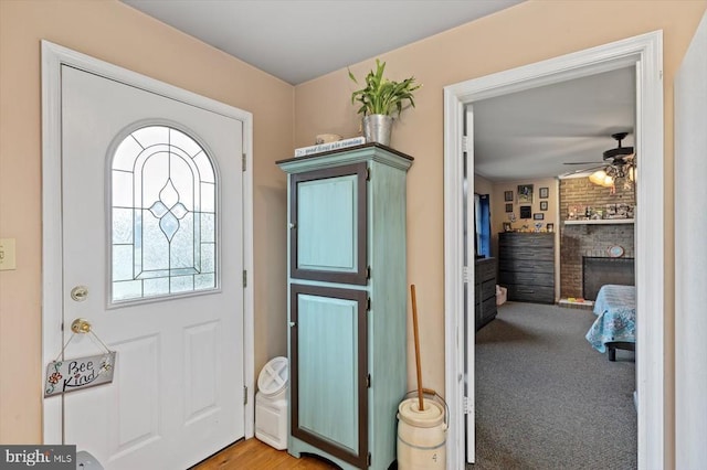 1117 Poor House Rd, Banco, VA 22711 - entryway featuring ceiling fan and a brick fireplace