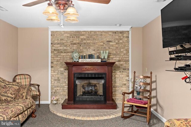 1117 Poor House Rd, Banco, VA 22711 - sitting room with ceiling fan, carpet floors, a brick fireplace, and ornamental molding