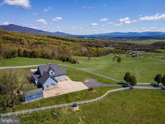 aerial view featuring a rural view and a mountain view