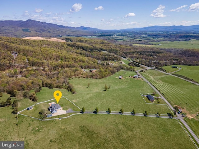 drone / aerial view featuring a rural view and a mountain view