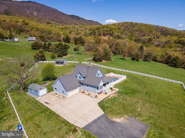 drone / aerial view featuring a view of trees