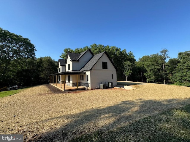  - view of home's exterior featuring a porch and board and batten siding