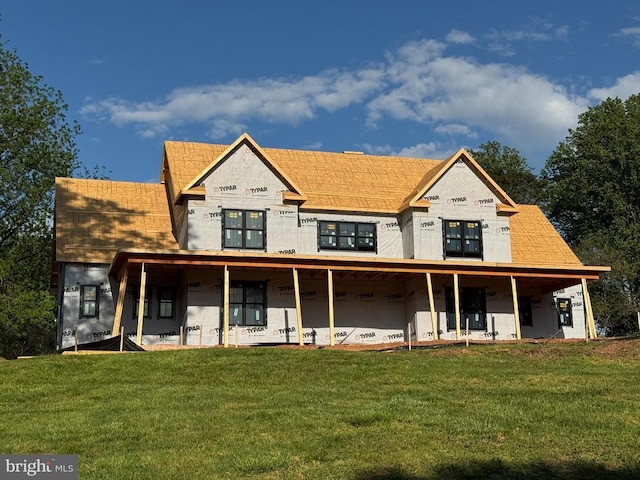  - rear view of house with a lawn