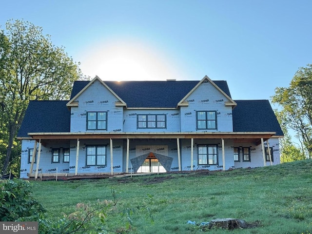  - view of front of property featuring a porch and a front lawn