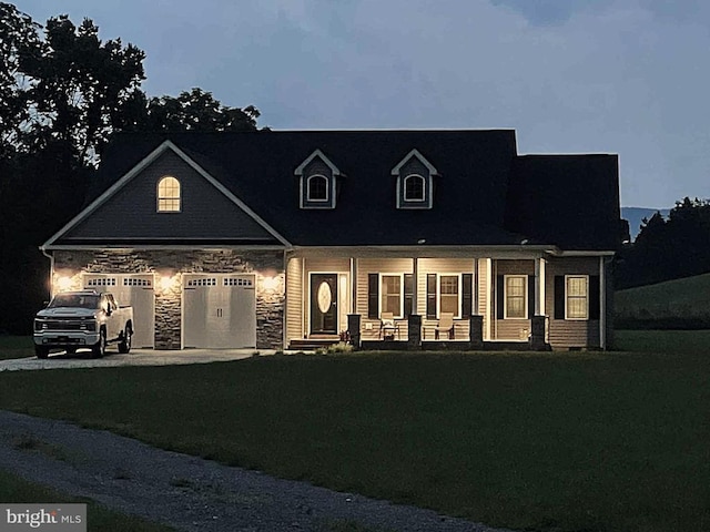 1835 Mill Creek Xrds, Luray, VA 22835 - cape cod home featuring covered porch, stone siding, an attached garage, a lawn, and driveway
