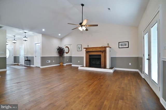 1835 Mill Creek Xrds, Luray, VA 22835 - unfurnished living room featuring vaulted ceiling, a fireplace with raised hearth, ceiling fan, wood finished floors, and recessed lighting