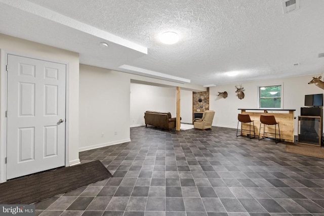 468 George James Loop, Radiant, VA 22732 - interior space with dark tile patterned flooring, a textured ceiling, baseboards, and visible vents