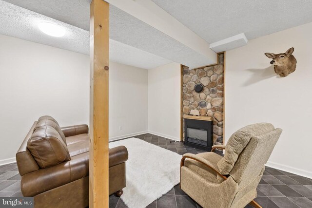 468 George James Loop, Radiant, VA 22732 - living area featuring a textured ceiling, a fireplace, and baseboards