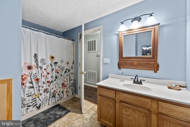 468 George James Loop, Radiant, VA 22732 - bathroom with a shower with curtain, vanity, visible vents, and a textured ceiling