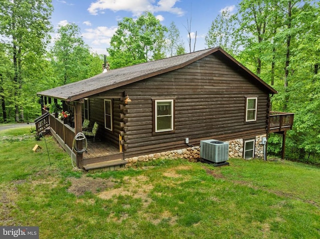 468 George James Loop, Radiant, VA 22732 - rear view of house featuring log siding, a wooden deck, cooling unit, and a lawn