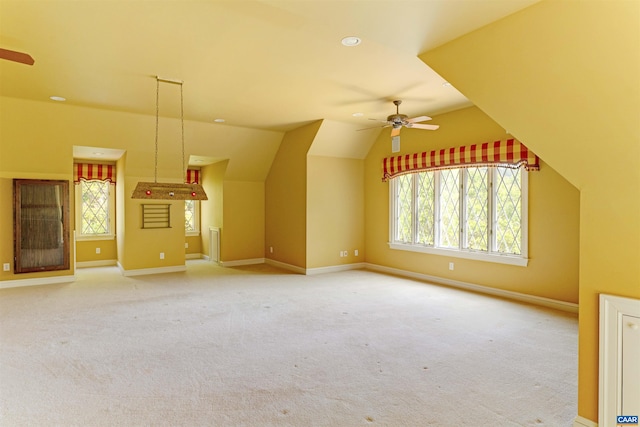 bonus room featuring a ceiling fan, baseboards, vaulted ceiling, and carpet floors