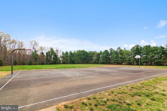 view of sport court with community basketball court and a yard