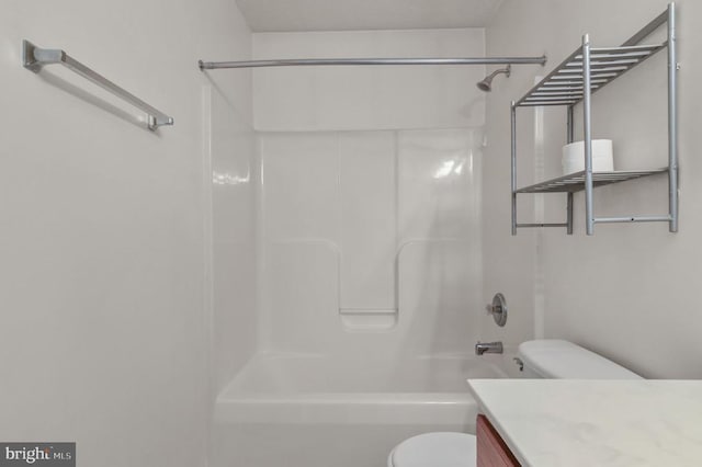full bathroom with toilet, vanity, and  shower combination