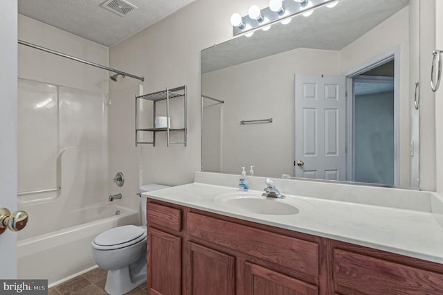 bathroom featuring toilet, vanity, shower / washtub combination, and tile patterned floors
