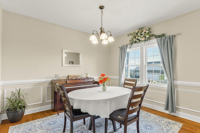 109 Beauregard Dr, Staunton, VA 24401 - dining area featuring a chandelier, wood finished floors, a wainscoted wall, and a decorative wall
