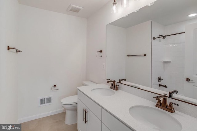 bathroom featuring toilet, a shower, double vanity, baseboards, and recessed lighting
