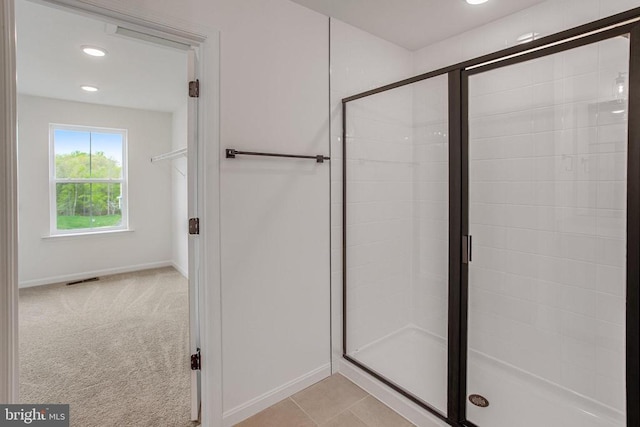 full bath with a shower stall, baseboards, and recessed lighting