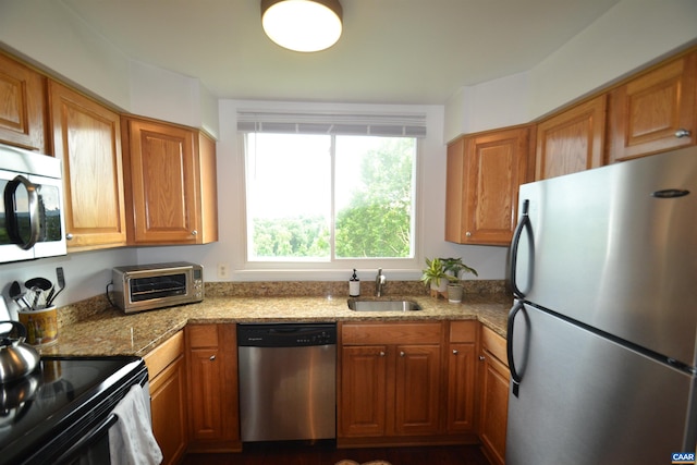 1606 Monticello Ave Unit G, Charlottesville, VA 22902 - kitchen with stainless steel appliances and brown cabinets