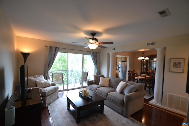 1606 Monticello Ave Unit G, Charlottesville, VA 22902 - living room with dark wood-style floors, a ceiling fan, ornate columns, and a chandelier